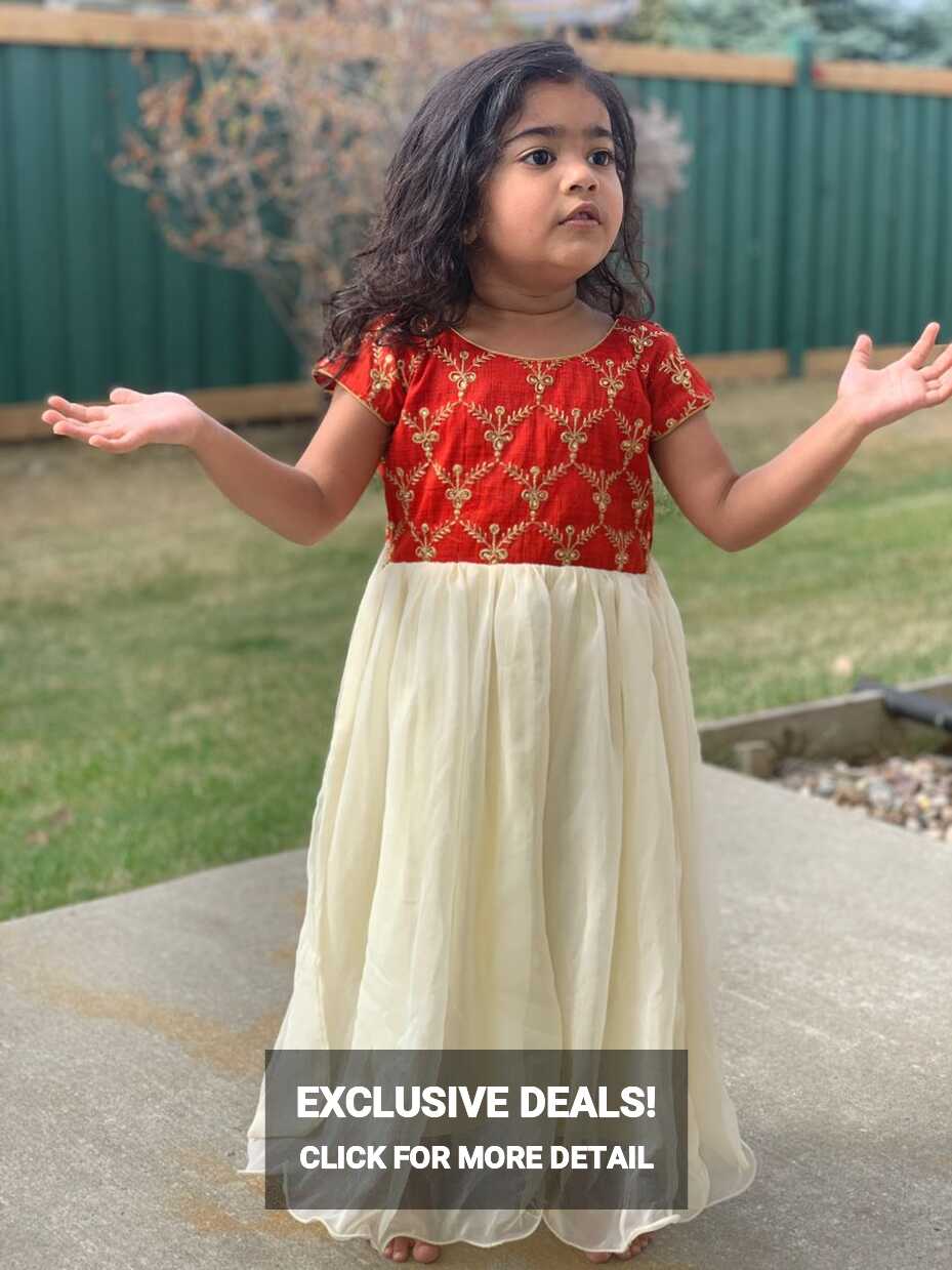 Baby in red and white georgette long frock