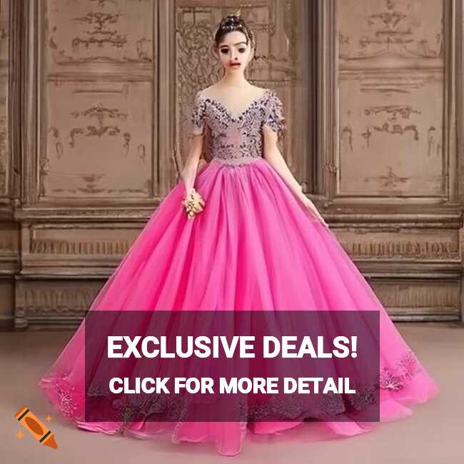 Elegant pink ball gown with intricate black embroidery skirt ...