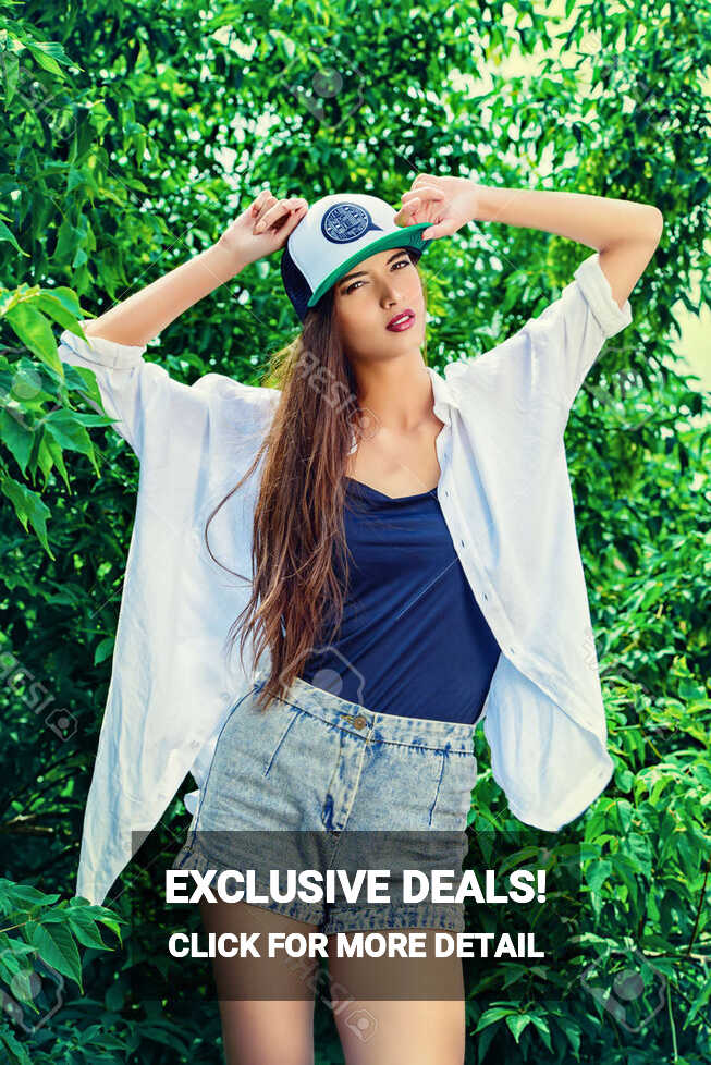 Modern Girl Wearing Casual Clothes And A Cap Posing Outdoor ...