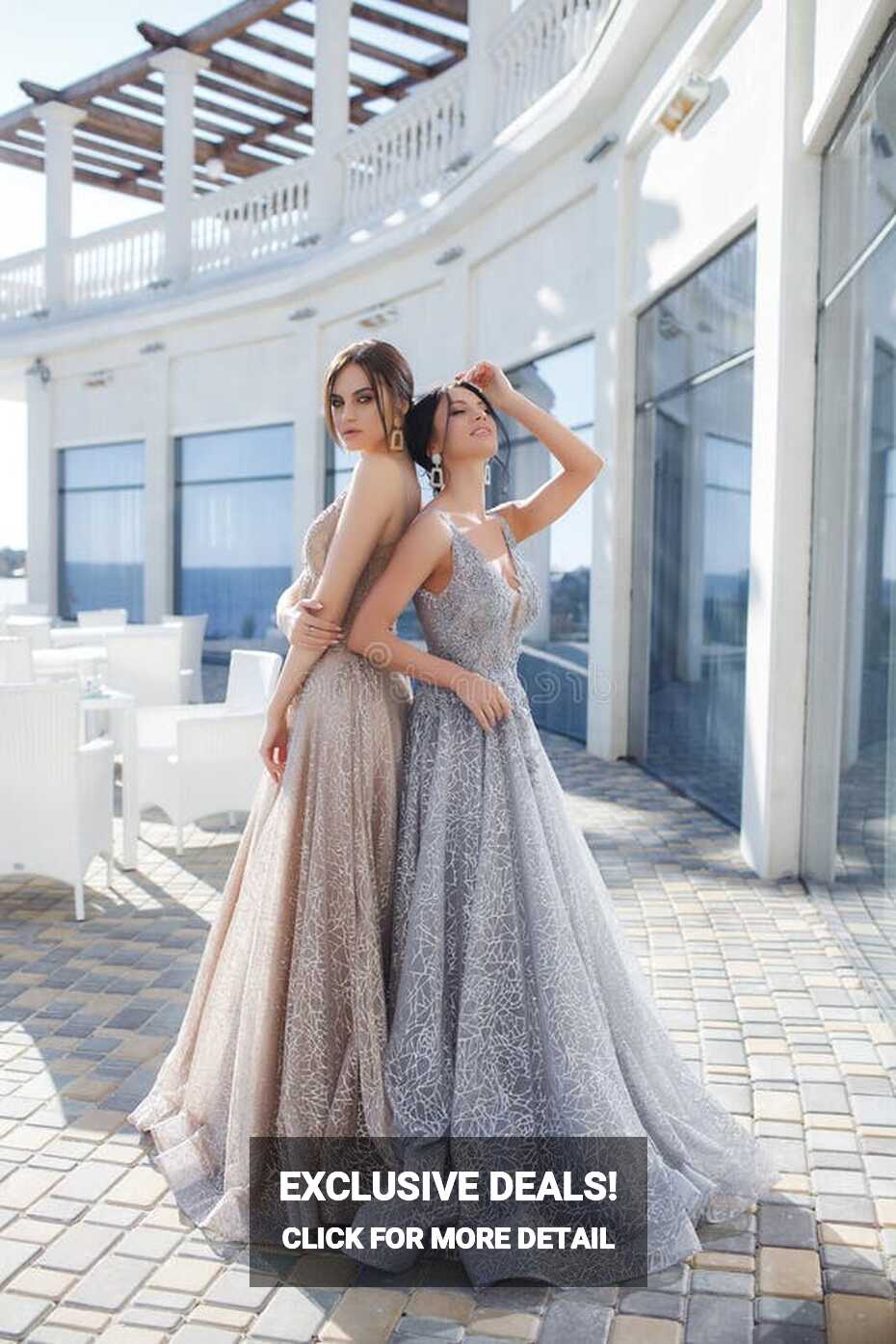 Two Beautiful Women, Models, Demonstrate Evening Dresses for ...