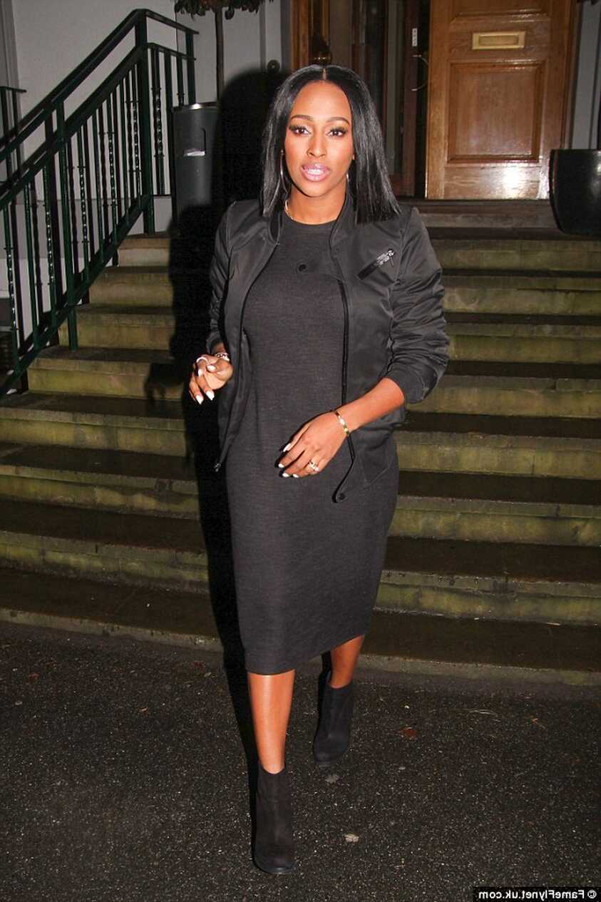 Alexandra Burke wears a black midi dress under a bomber jacket ...