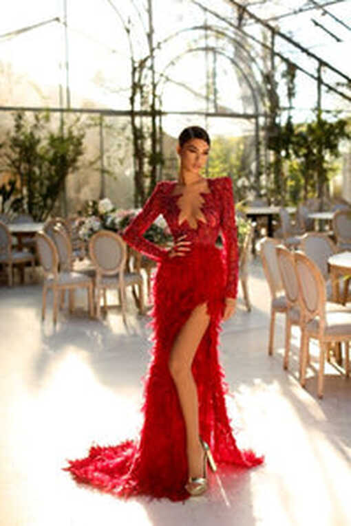 BEADED RED CORSET DRESS WITH LONG FEATHER SKIRT