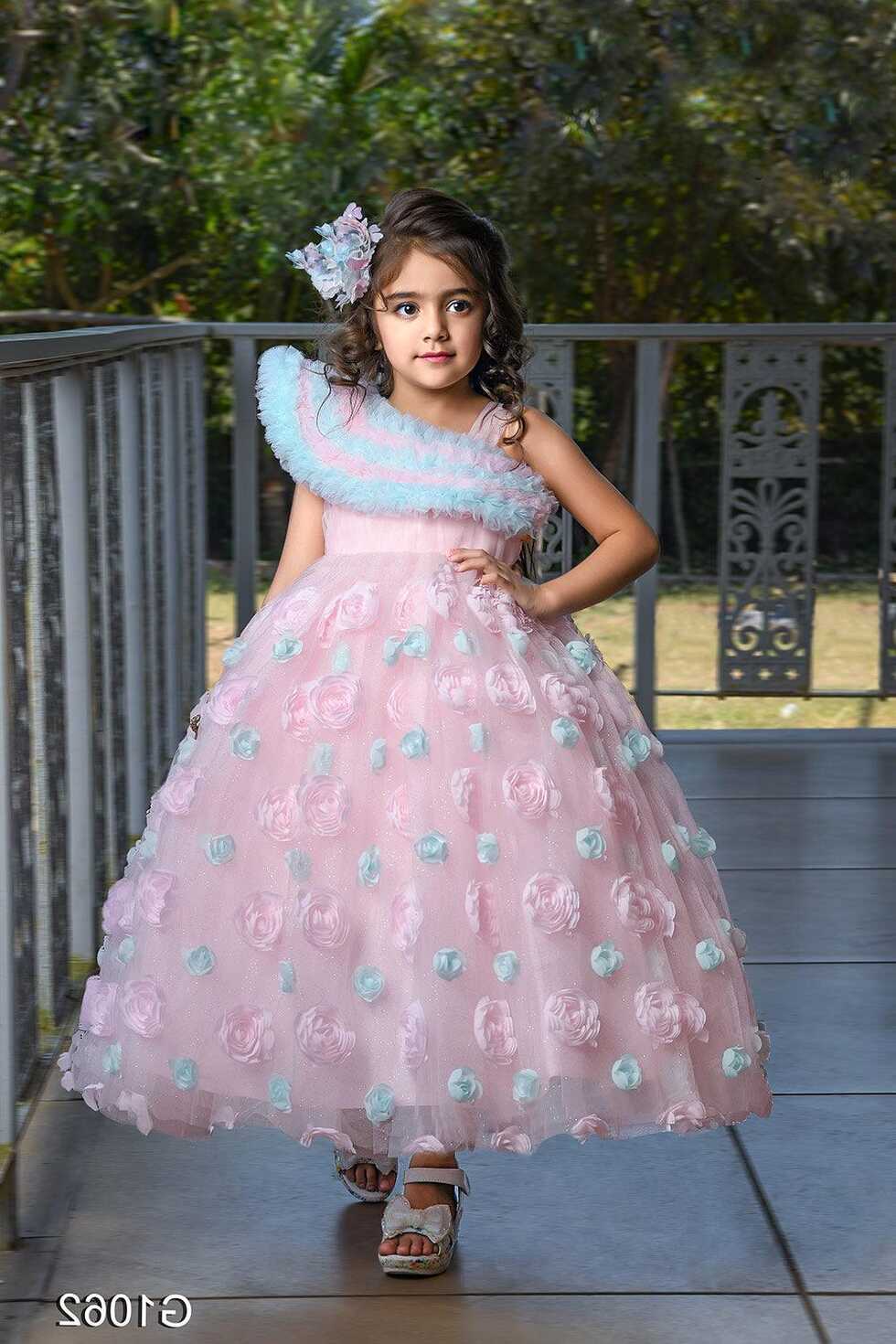 Baby pink princess gown with frilled neckline and floral ...