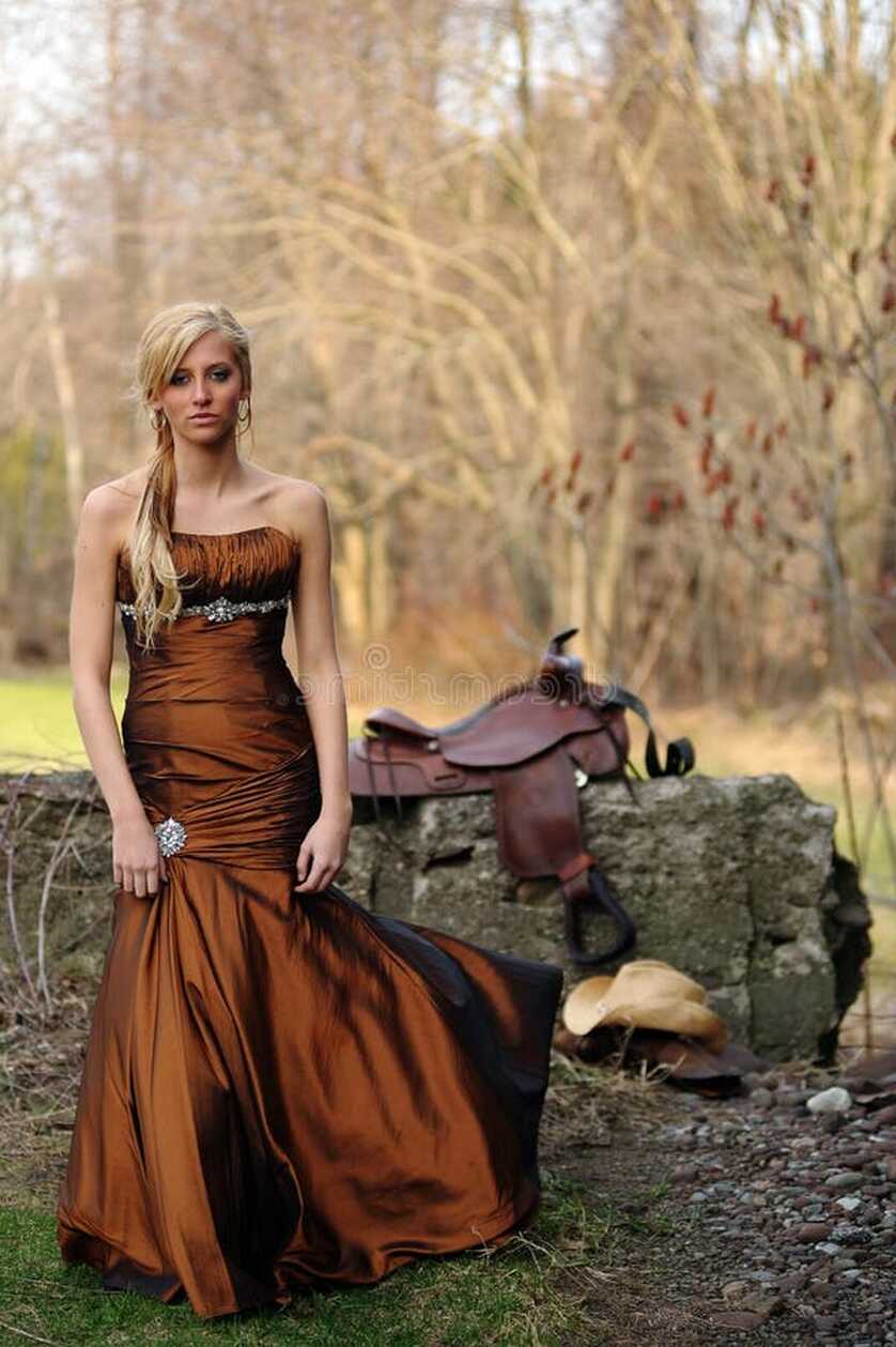 Beautiful Cowgirl in a Formal Dress Near a Cement Wall Stock Photo ...