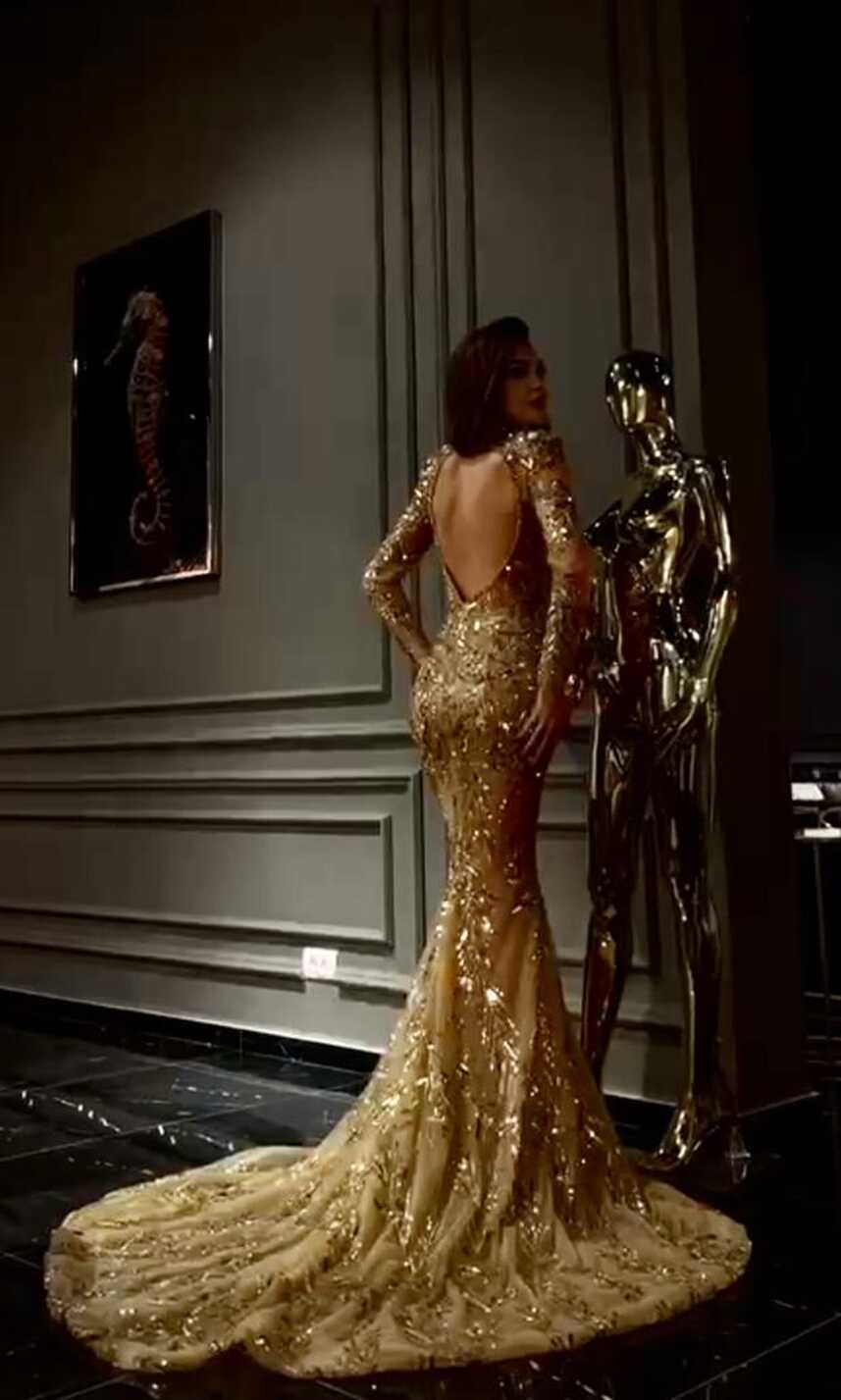 GOLD BEADED LONG SLEEVE OPEN BACK GOWN