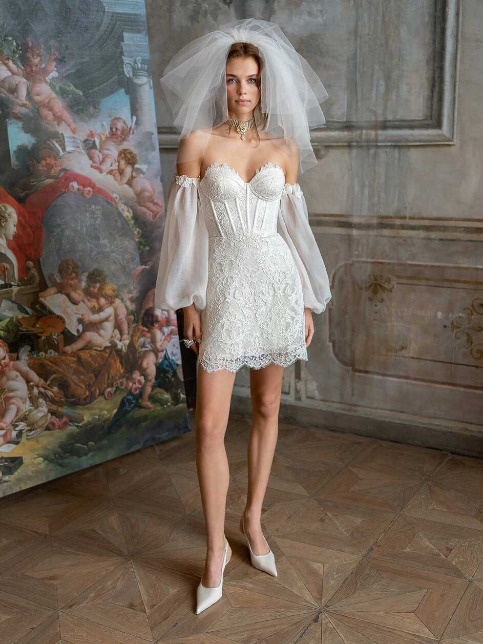 Mini wedding dress with detachable sleeves and overskirt