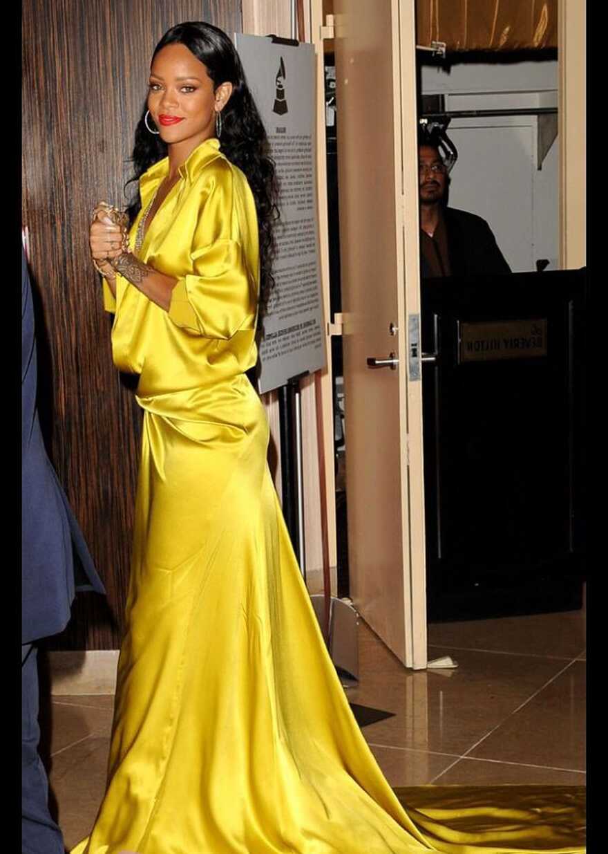 Rihanna in a gold-yellow maxi dress