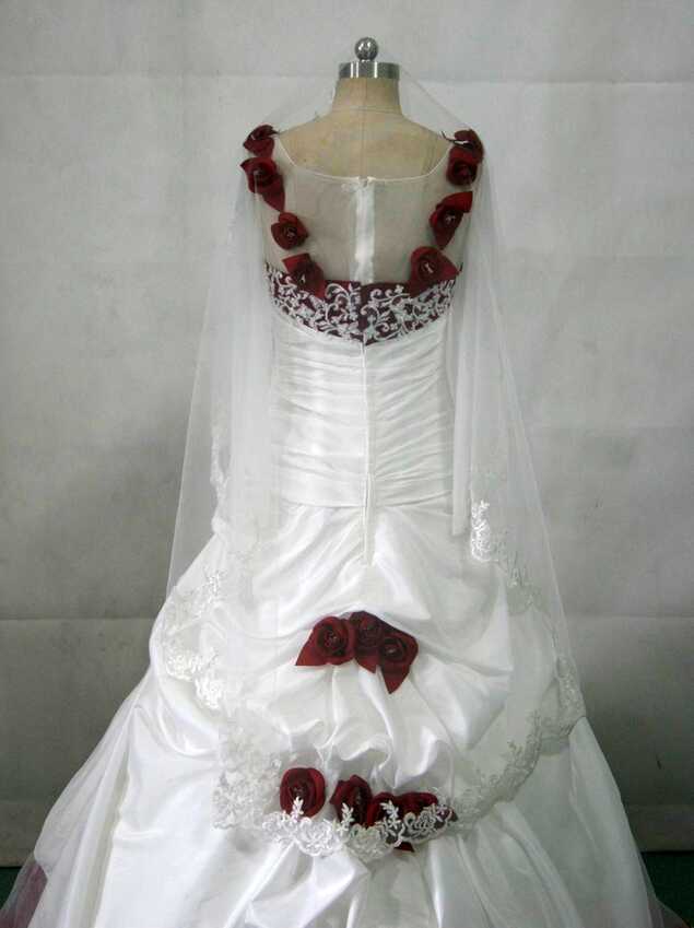 White wedding gown with red roses.