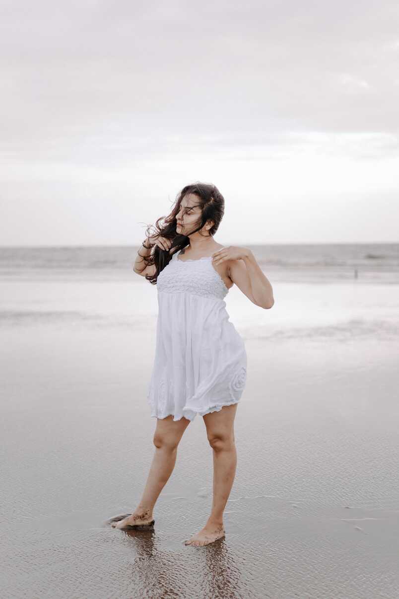 Woman Wearing White Dress on a Beach · Free Stock Photo